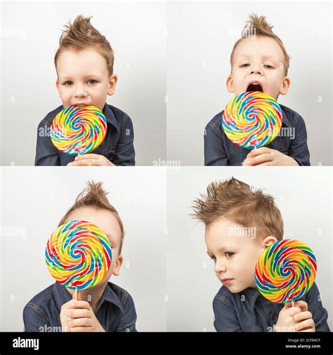 A Boy In A Denim Shirt Eating Lollipop Happy Kid With A Big Candy On