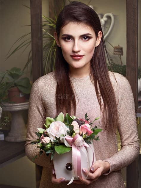 Young Beautiful Brunette Business Woman Florist Holding Trendy Bouquet