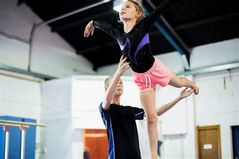 Gymnastics Coach Uses Student