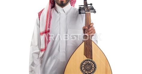 A Close Up Of A Saudi Arabian Gulf Man Holding In His Hands The Oud