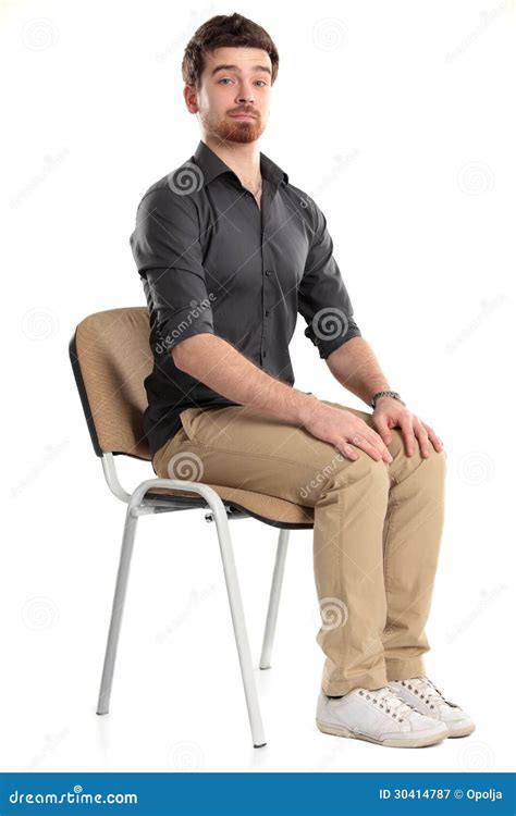 Young Caucasian Handsome Man Sitting On The Chair Royalty Free Stock