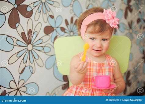 Girl With Yellow Spoon Stock Image Image Of Room Indoors 48302703