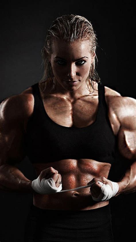A Female Bodybuilding Competitor Posing For The Camera