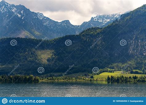 Summer Landscaped Green Forest With Mountain And Lake At Hallstatt