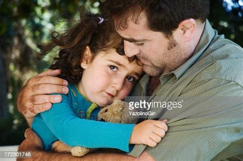 Photo Of A Father Comforting His Young Daughter High Res Stock Photo