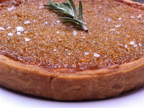 Treacle tart is a traditional english dessert made with shortcrust pastry, filled with a golden syrup mixture, and often served with ice cream. Treacle tart with rosemary salt & clotted cream ice cream ...