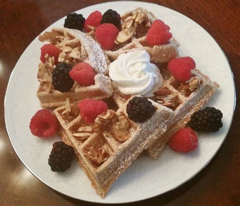 Spiced Brown Butter Waffles Topped With Fresh Berries Salted Praline
