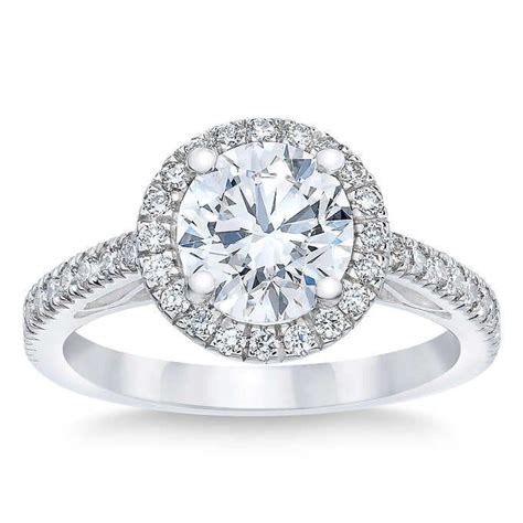 Costco's engagement ring retails for $10,999.99 and features the following specifications: Round Brilliant 2.53 ctw VVS2 Clarity, H Color Diamond Platinum Halo Ring in 2020 | Gold diamond ...