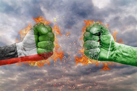 Two Fist With The Flag Of United Arab Emirates And Saudi Arabia Faced At Each Other Stock Image