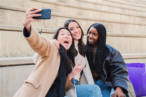 Group Of Young Woman Having Fun Doing A Selfie With Smartphone Three Multiracial Happy Girls
