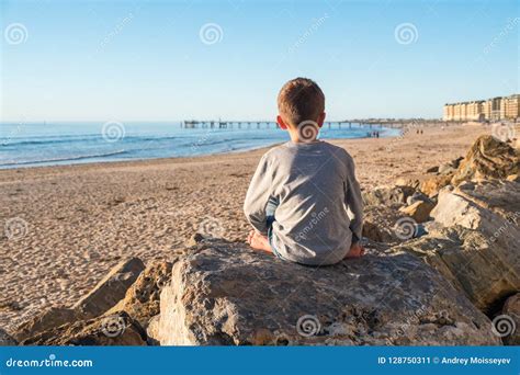 Lonely Barefoot Boy Sitting On The Rock Stock Image Image Of Little