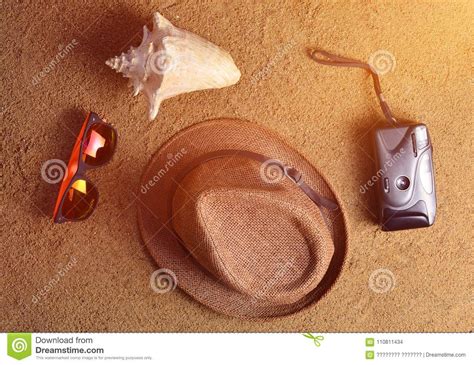 Beach Accessories Lie On The Sandhat Camera Sunglasses Shell The