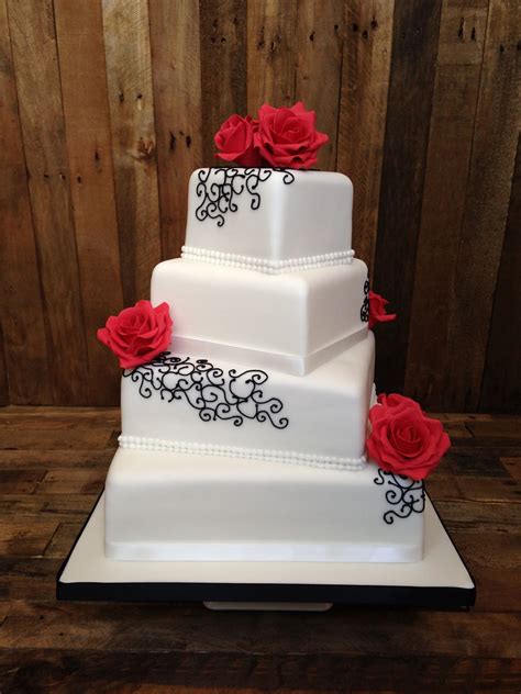 Square Four Tier Wedding Cake With Black Swirl Piping And Red Roses