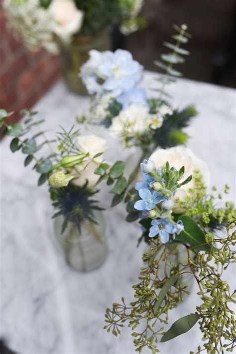Mini Bud Vase Arrangement Featuring With White Blue Blooms And