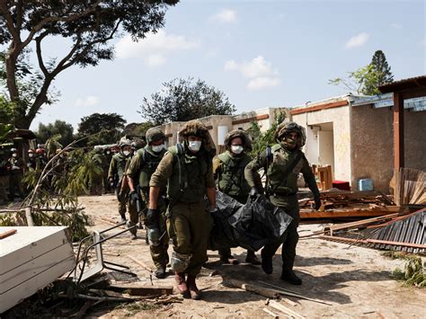 ‘Horrific scenes’ as dozens of bodies found in Israel’s Kfar Aza near