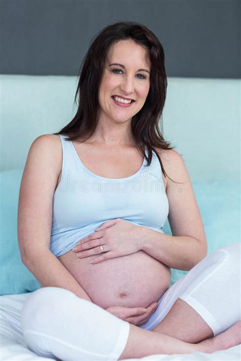 Pregnant Woman Sitting On Bed Stock Image Image Of Bedroom Pillows