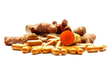 Premium Photo Turmeric Or Curcuma Longa And Herbal Capsule Isolated