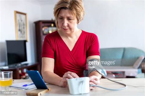 Blood Pressure Monitoring At Home Photos And Premium High Res Pictures