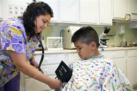 Measuring A Childs Blood Pressure Stock Image C0205002 Science