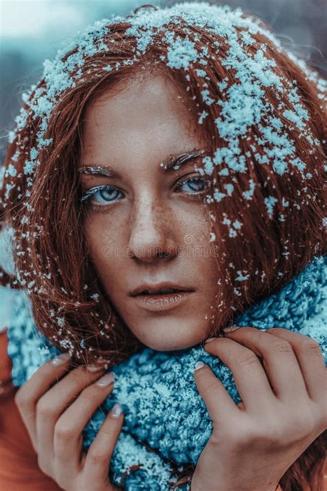 beautiful redhead woman in snow background portrait beauty portrait photoshoot stock image