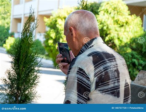 Elderly Man Talking On A Cell Phone On Speakerphone Editorial Image Image Of Number Device