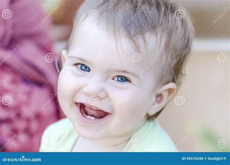 Closeup Of Happy Baby Smiling With Her First Teeth Stock Photo Image