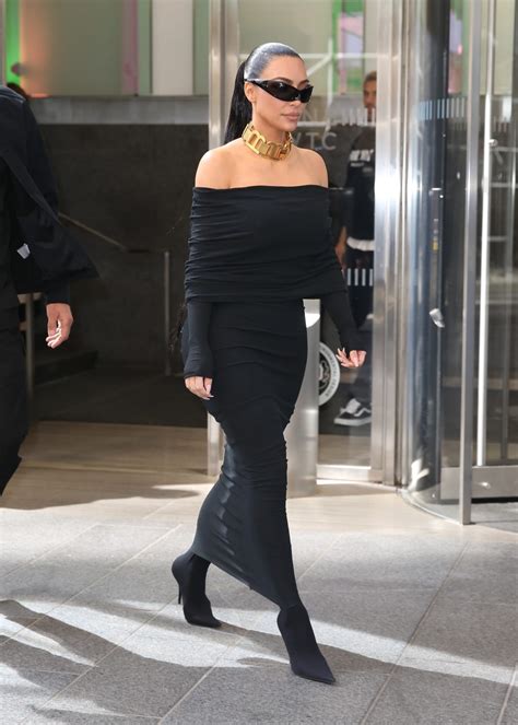 kim kardashian can barely walk in balenciaga fall 2022 off the shoulder black long sleeve maxi