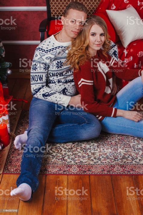 Young Romantic Cute Couple Staying At Home And Enjoying Time Together Lovers Hugging In Cristmas