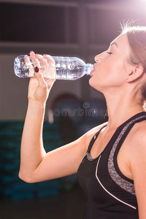 Fitness Young Woman Drinking Water From Bottle Muscular Young Female