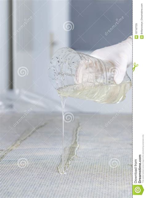 Hands With Protetctive Gloves Pouring Glue On Mesh Stock Image Image