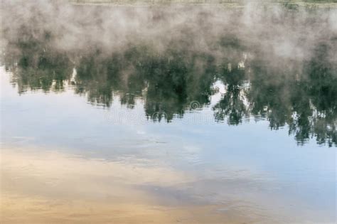 Sunrise On A River With A Mist Over The Water Stock Photo Image Of