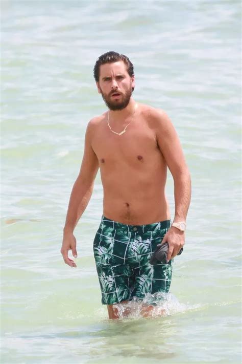 scott disick does his best james bond impression while emerging topless from the sea during