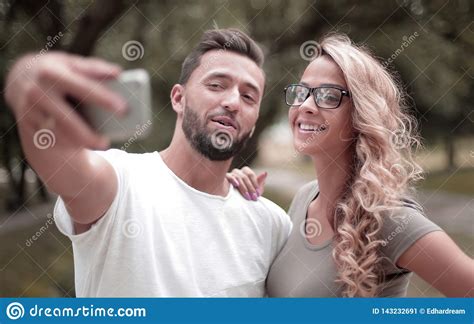 Close Upsmiling Young Couple Taking Selfie In City Park Stock Image Image Of Romantic Girl
