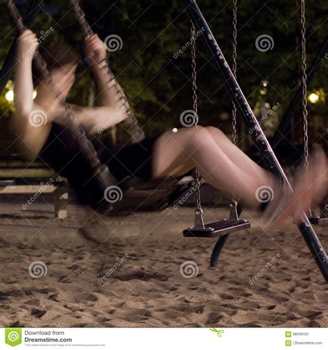 Blurry Girl On A Swing At Night Stock Image Image Of