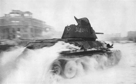 Soviet T 34 Tank Drives Through The Square Of Fallen Fighters In