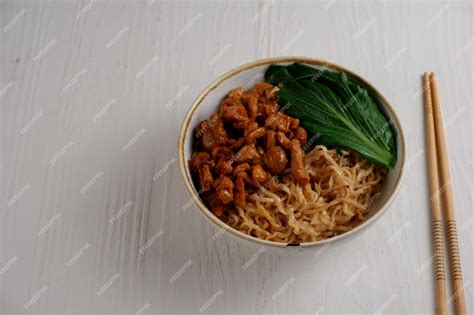 Premium Photo Bakmi Or Mie Ayam Noodles With Chiken And Served With