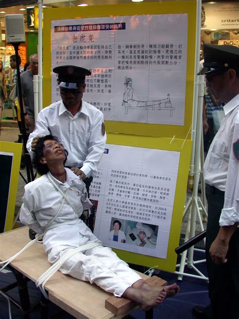 hong kong falun gong practitioners hold anti torture exhibition on international day to support