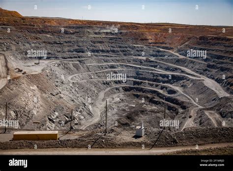 Copper Ore Open Pit Mining Quarry In Steppe White Gravel Road Blue