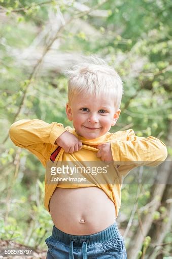 Smiling Boy Showing Belly Stock Photo Getty Images