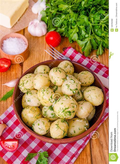 This better preserves the flavor during the boiling process and adds a nice texture. Boiled Young Potatoes With Butter, Dill And Garlic Stock Photo - Image of vegetables, creamy ...