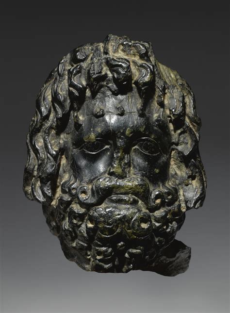 A Roman Black Stone Head Of Zeus Serapis Circa Late 2nd Century Ad