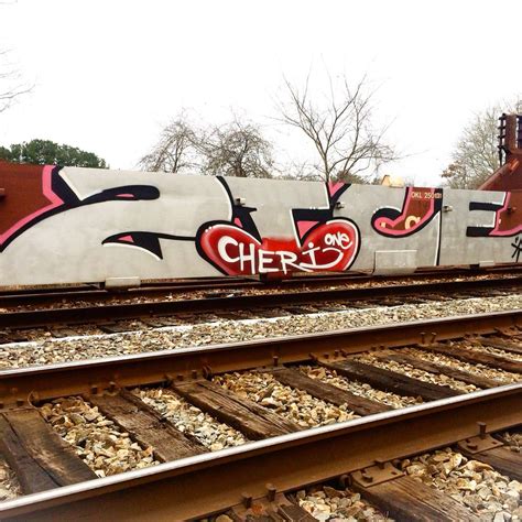 Graffiti On The Side Of A Train Track