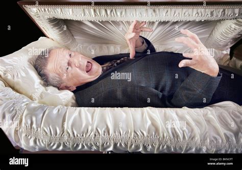 A Man Alive And Laying In A Coffin Stock Photo Alamy