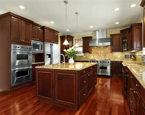 The first thing you notice in this kitchen is the large columns with multiple layers of trim work and crown molding. Kitchens With Cherry Wood Cabinets Design, Pictures ...