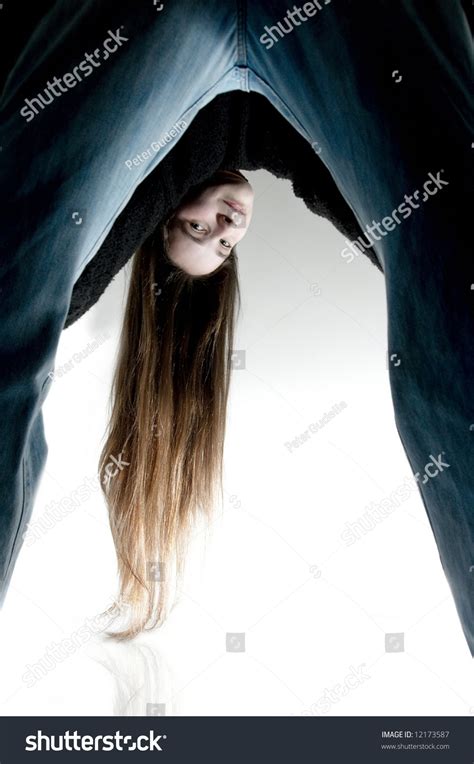 Young Girl Bending Over Looking Backwards Foto Stock 12173587
