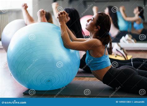 Women Doing Stretching Exercises On Sporting Balls Stock Image Image