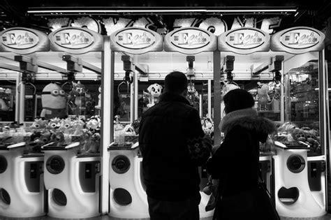3840x2557 Black And White Claw Machines Couple Man People Playing Woman 4k Wallpaper