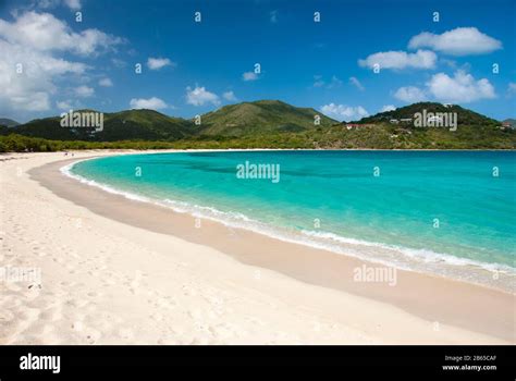 Bright Scenic Empty View Of Wide Curving Caribbean Beach At Long Bay Beef Island Tortola