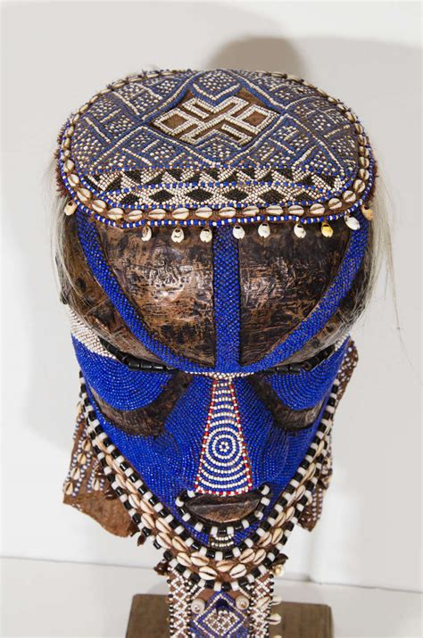 They are used both in the rituals of the court and in the initiation of boys into adulthood, as well as at funerals. A Contemporary Beaded Kuba Mask or Helmet at 1stdibs