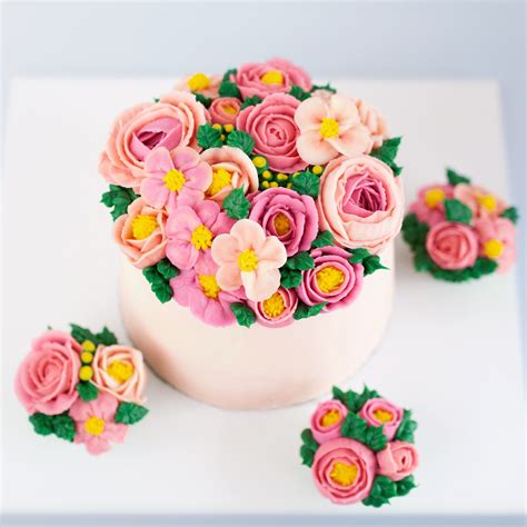 The cake is iced in vanilla buttercream. Mother's Day cake #buttercreamcake #buttercreamflowers # ...